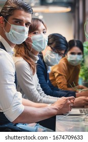 Business People Wearing Medical Mask For Coronavirus Covid 19 Protection Working Together At Coworking Spaces, Working Safety In Novel Coronavirus Covid 19 Outbreak Situation, Selective Focused