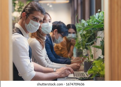 Business People Wearing Medical Mask For Coronavirus Covid 19 Protection Working Together At Coworking Spaces, Working Safety In Novel Coronavirus Covid 19 Outbreak Situation, Selective Focused