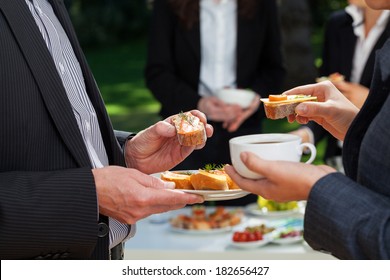 Business people who are eating lunch in the garden  - Powered by Shutterstock