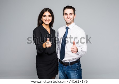 Business people who have their thumbs up