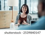 Business people, woman and consulting in office for human resources, training and employee development. Hr, employee and notebook for discussion, company policy and performance review with feedback