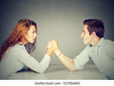 Business People Woman And Man Arm Wrestling  