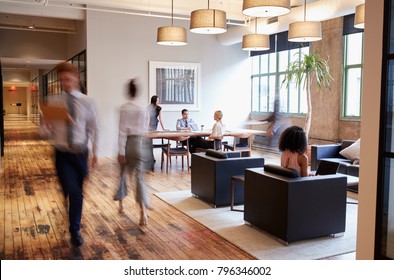 Business people at work in a busy luxury office space