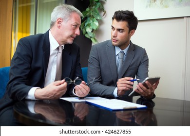 Business people at work in their office - Powered by Shutterstock