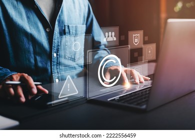 Business people work through laptops, concepts of copyright or intellectual property patents, piracy protection, proprietary representation, legitimate innovations and inventions, patent campaigning. - Shutterstock ID 2222556459