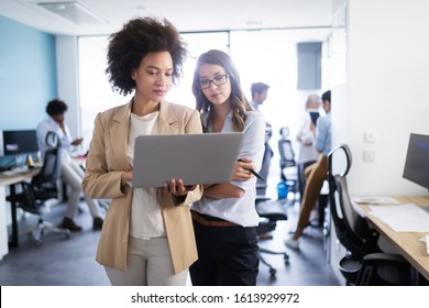 Business people working and brainstorming in office - Shutterstock ID 1613929972