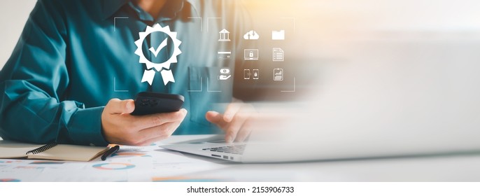 Business people working with computers and smartphones A symbol of top service ISO Certification Document Management System Quality assurance. - Shutterstock ID 2153906733