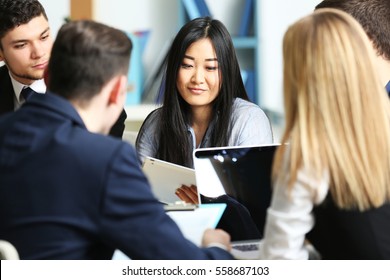 Business people working in conference room - Shutterstock ID 558687103