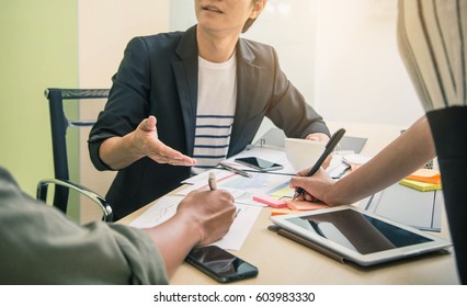 Business people working in conference room. Team businessman job . working with laptop in open space office. Meeting report in progress. - Shutterstock ID 603983330