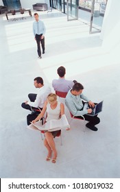 Business People Working In Lobby