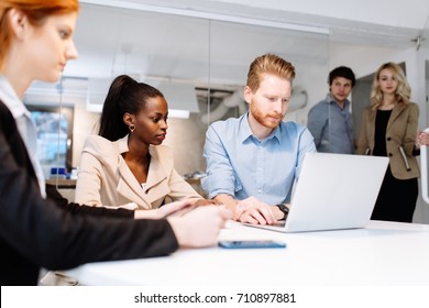 Business people working in office - Shutterstock ID 710897881