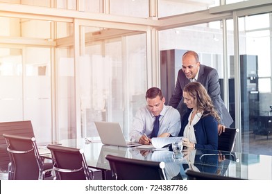 Business People Working And Planning In Start Up Teamwork. Three Business People Working Hard Together And Sitting In The Office With Laptop. Businessman Signing A Document During A Meeting.