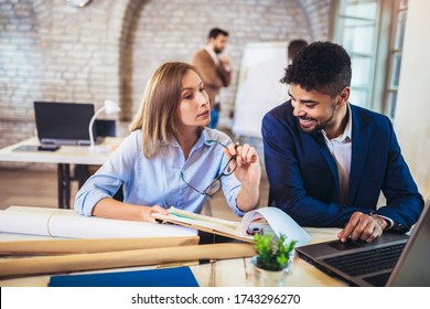 Business people working together in modern office. - Shutterstock ID 1743296270