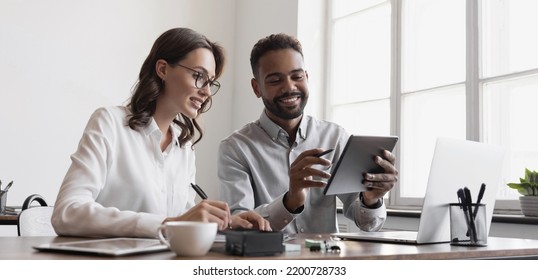 Business people working together in office and planning new project. Meeting and discussing strategy, brainstorming, startup, employee engagement, teamwork, business casual, partnership concepts - Shutterstock ID 2200728733