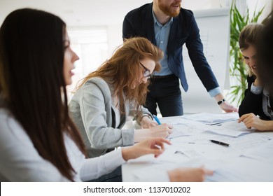 Business people working together on project - Shutterstock ID 1137010202