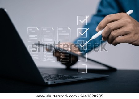 Business performance checklist, Business evaluation, project approval and enhancing business performance. Businessman using laptop to checking mark on check box to approved documents.