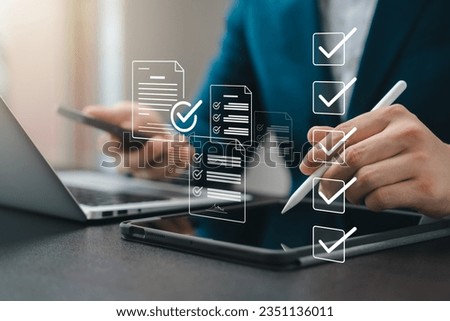 Business performance monitoring concept, businessman using tablet and laptop Online survey filling out, digital form checklist, blue background.