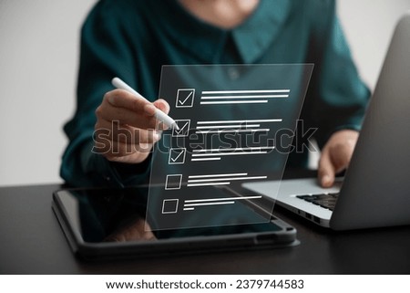 Business performance monitoring concept, businesswoman using laptop and tablet Online survey filling out, digital form checklist.