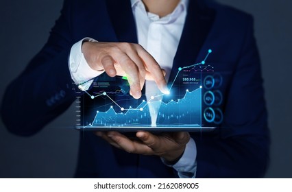 Business person  analysing growing virtual hologram of statistics, graph and chart. Investment of growth on currency rate.Business strategy development and growing growth plan.
 - Shutterstock ID 2162089005