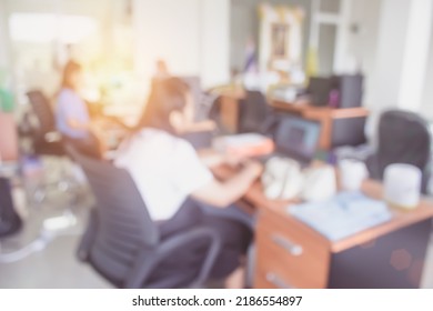 Business Person Blur In The Workplace At Sitting On A Computer Screen Work Space On Table Desk Work In Office Blurry, Document Division And People Shallow Depth Of Focus Horizontal Abstract Interior.