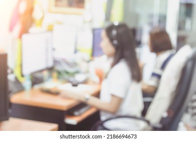 Business Person Blur In The Workplace At Sitting On A Computer Screen Work Space On Table Desk Work In Office Blurry, Document Division And People Shallow Depth Of Focus Horizontal Abstract Interior.