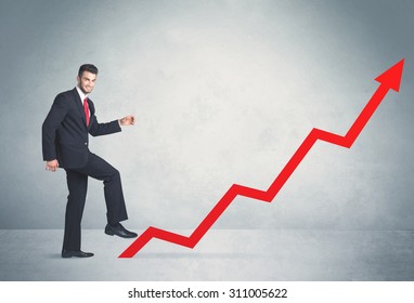 Business Person Climbing On Red Graph Arrow