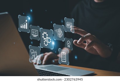 Business person dress in formal suit holding an icon that show the component of Business that do digital transformation for industrial or manufacturing vertical
