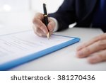 Business person filling contract, selective focus