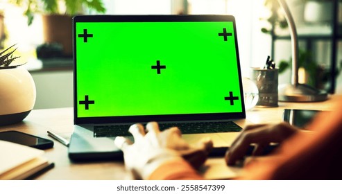 Business person, hands and laptop with green screen for online advertising, journalism or software app at home office. Closeup, journalist or computer with chromakey, mockup space or tracking markers - Powered by Shutterstock