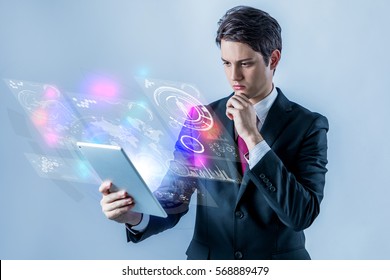 Business Person Holding Futuristic Tablet PC