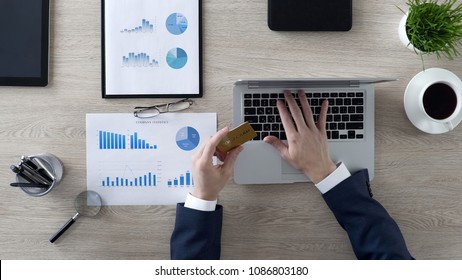 Business Person Inserting Gold Credit Card Number On Laptop, Man Buying Company