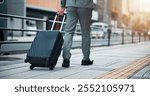 Business person, legs and walking with suitcase in city for travel, commute or trip on sidewalk or pavement. Japan, immigration or traveler with luggage for job or career opportunity in an urban town