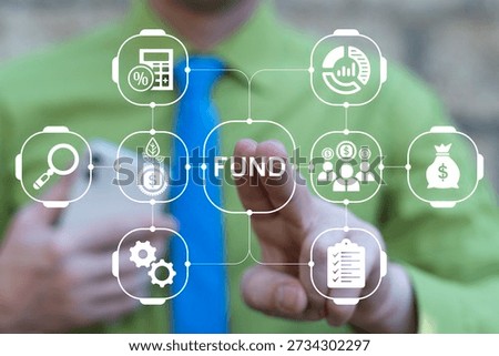 Business person using virtual touch screen presses the word FUND. Concept of funding and grants for business and education. Grant funding application.