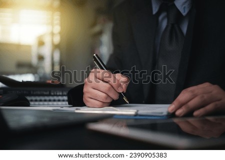 Business person Writing contract law and paper work for business and finance, write document, complete job application forms, contract real estate and insurance concept.	