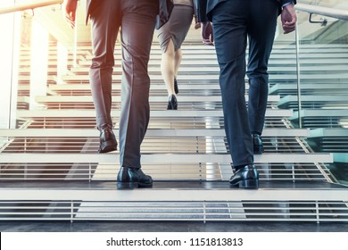 Business Persons Going Up The Stairs.