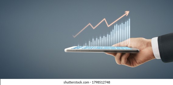 Business Plan Graph Growth And Increase Of Chart Positive Indicators In His Business, Tablet In Hand