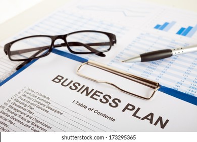 Business plan over financial charts