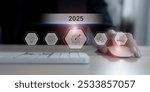 Business planning in 2025 concept. Business professional working with computer representing goals, innovation and growth, with the year "2025" forward-thinking strategy and technological planning.