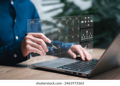 Business Planning Calendar Agenda work schedule concept, Businesswomen use pen marks on the virtual screen calendar, workflow plan, and Organize schedules and important dates. Work time management