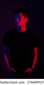 business portrait of an asian guy with color light blue and red