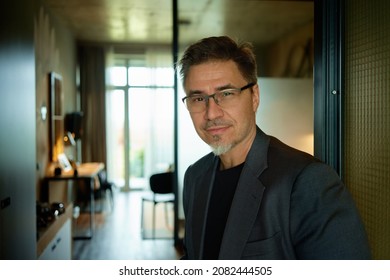 Business Portrait - Businessman In Glasses. Mature Age, Middle Age, Mid Adult Casual Man In 50s, Confident Happy Smiling.