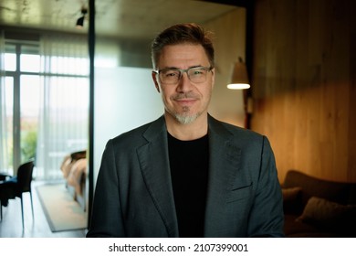 Business Portrait - Businessman In Glasses. Mature Age, Middle Age, Mid Adult Casual Man In 50s, Confident Happy Smiling.