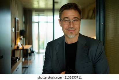 Business Portrait - Businessman In Office. Mature Age, Middle Age, Mid Adult Casual Man In 50s, Confident Happy Smiling.