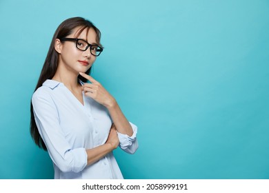 Business Portrait Of Young Asian Woman On Blue Background