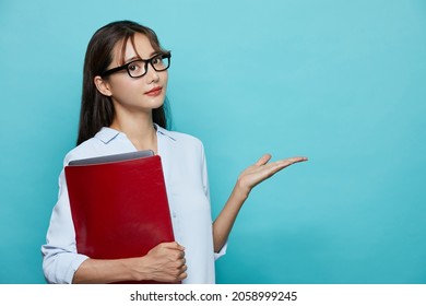 Business Portrait Of Young Asian Woman On Blue Background