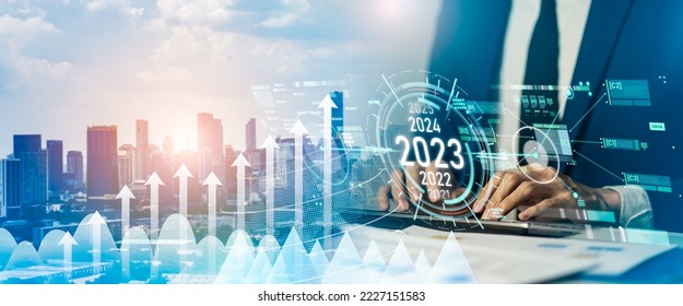 Business positive indicators in 2023 concept.Businessman analysis profitability of working companies with digital augmented reality.Business development to success and growing growth year 2022 to 2023 - Shutterstock ID 2227151583