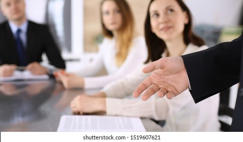 Business presentation. Businessman giving speech to colleagues and partners at corporate meeting or conference, close-up of speaker hands - Shutterstock ID 1519607621