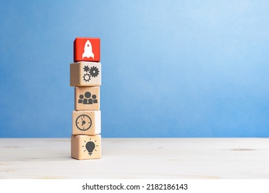 Business process management, Wooden cubes with business strategy and rocket icon, copy space - Shutterstock ID 2182186143