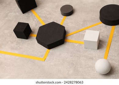 Business process organization and optimization. Scheme with geometric figures on light grey table - Powered by Shutterstock - Get 15% off with code: PIKWIZARD15