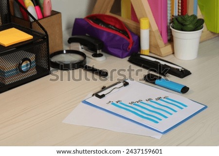 Business process planning and optimization. Workplace with graph and different stationery on wooden table